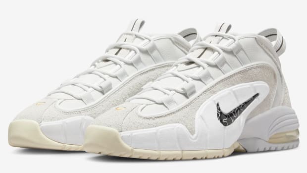 Grey and white Nike Penny shoes.